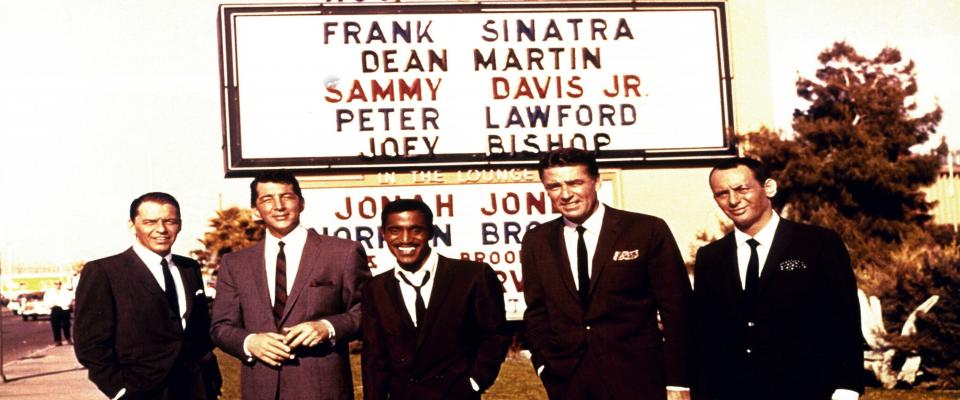 the Rat Pack standing in front of marquee