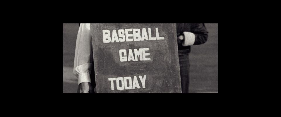 a black and white image of a sign reading "baseball game today"