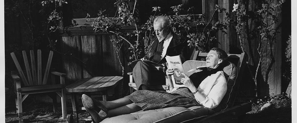 A reader reclining next to a man