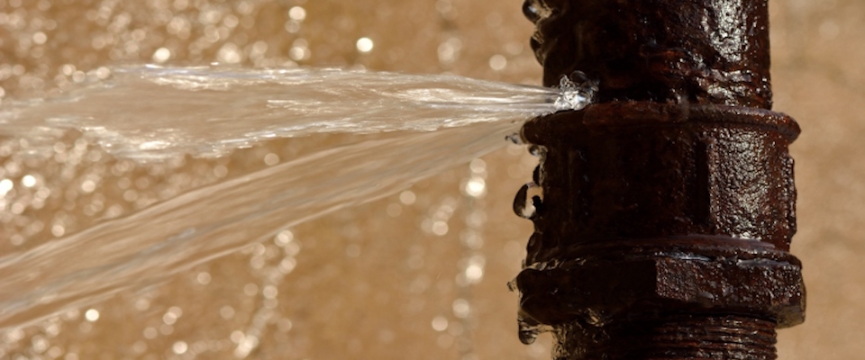 Water spurting out of a pipe