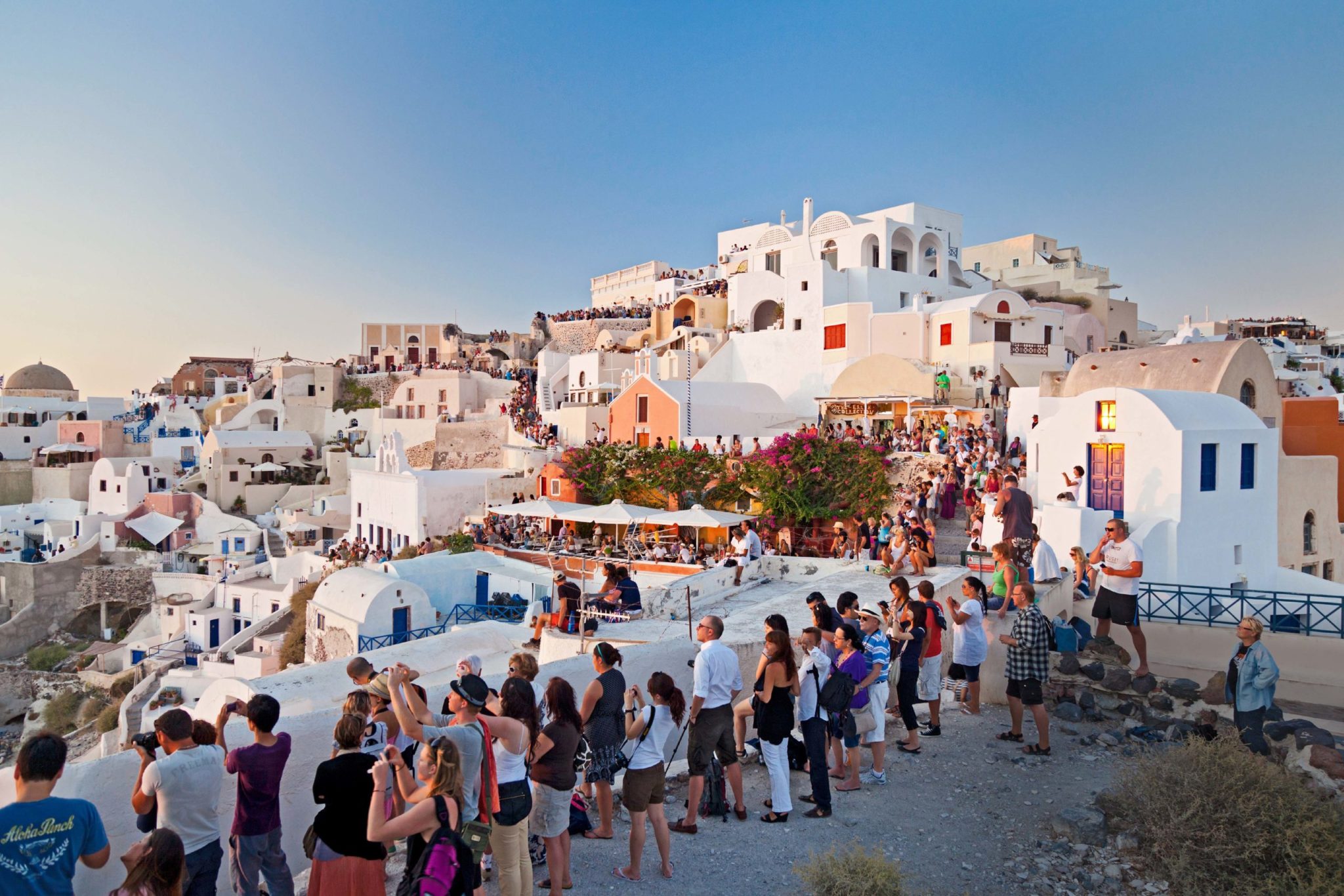 People lined up to watch the sun set in Greece.