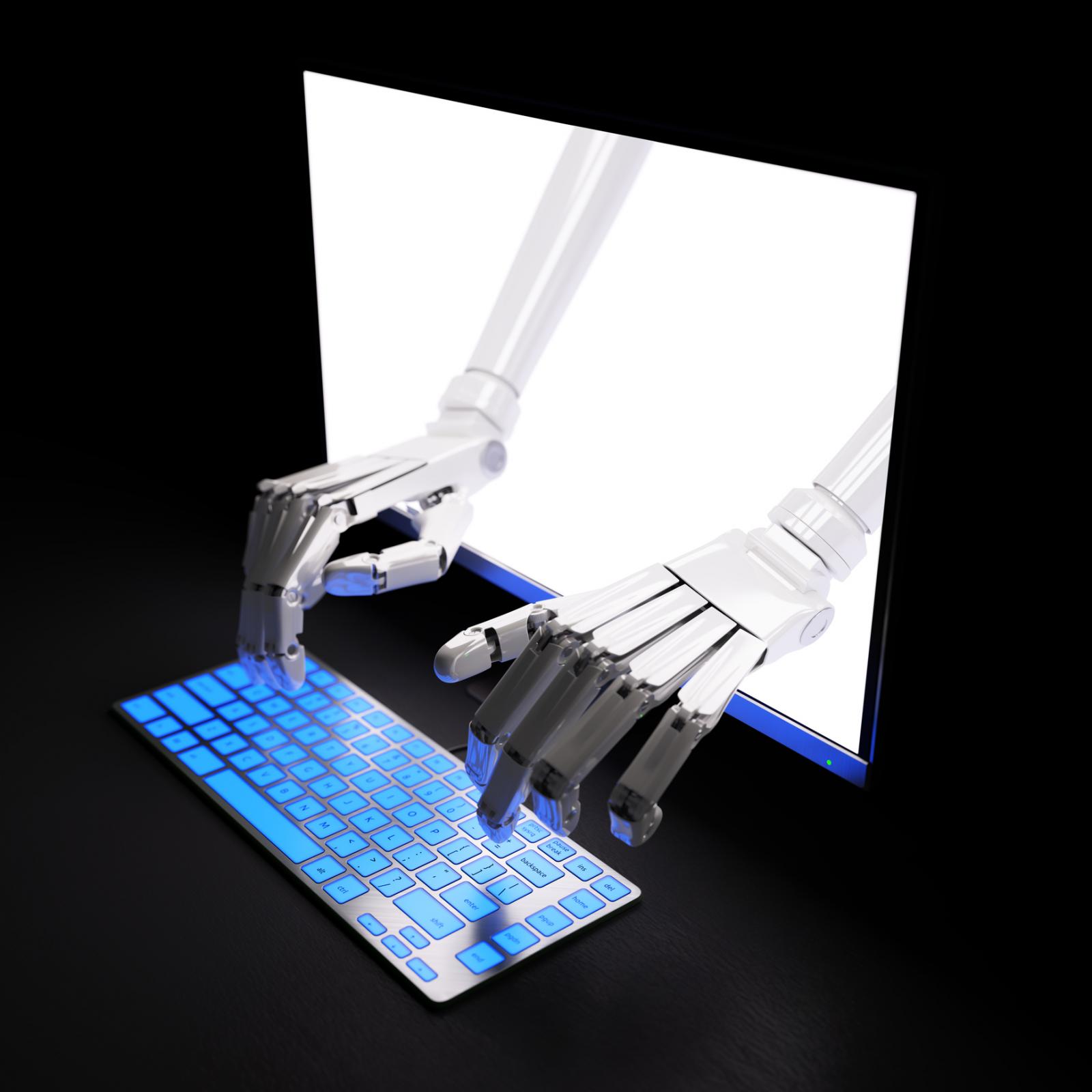 Image of robot hands typing on a computer