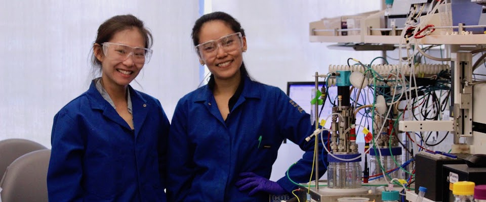 Two women standing in a lab