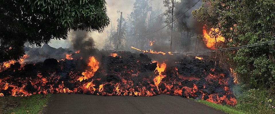 Lava flowing across a road in Hawaii
