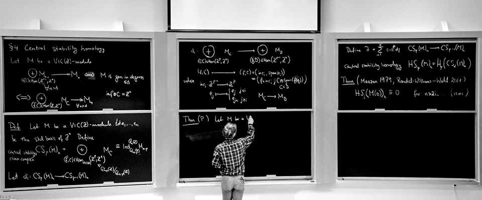 Mathematician at a chalk board