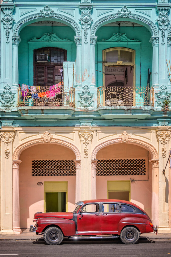 Classic vintage car and coloful colonial buildings in Old Havana, Cuba