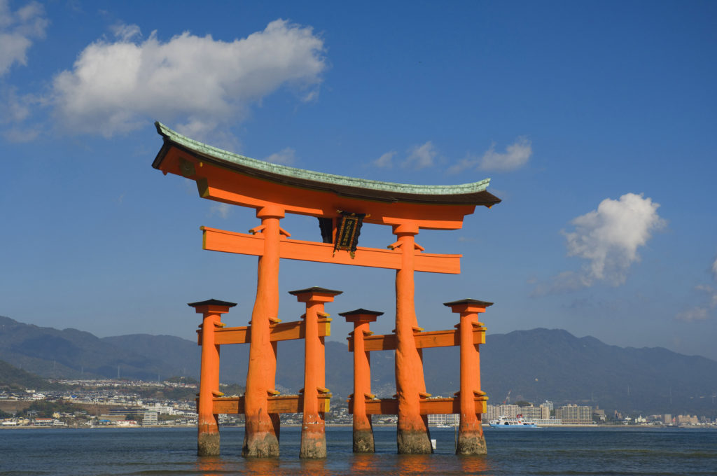 Red Japanese torii gate in water