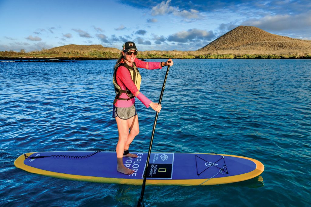 Stand-up paddle boarder near Floreana Island, Galapagos Islands National Park, Ecuador