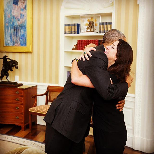 Barack Obama and Hope Hall embracing in the Oval Office