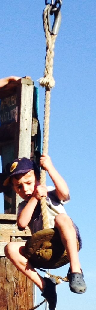 Close up of boy on zipline
