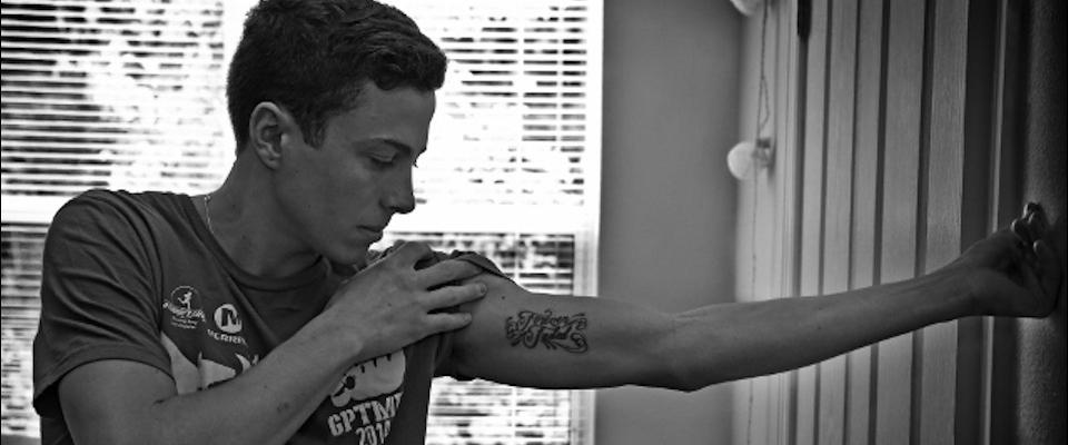 Photo of a someone showing off a tattoo on their bicep
