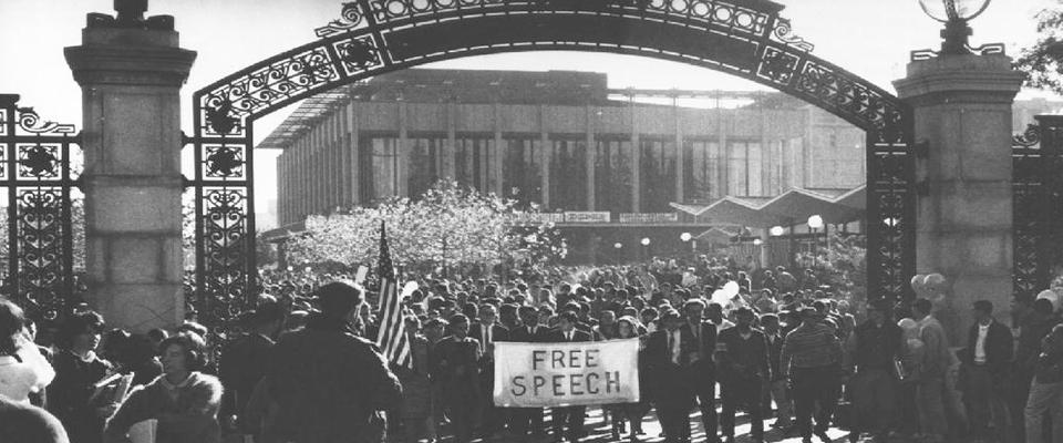 A crowd gathered around a free speech sign