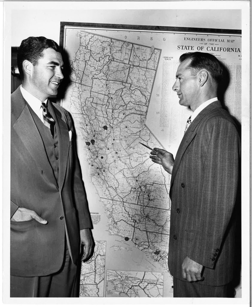 old lair staff McCaffrey and Koll with map