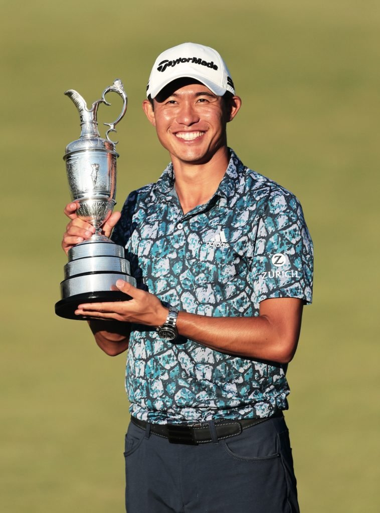 Morikawa holding a trophy