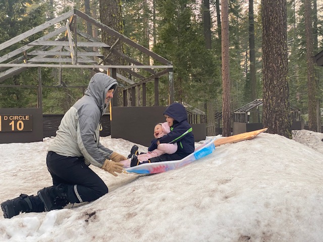 family sledding with young kid