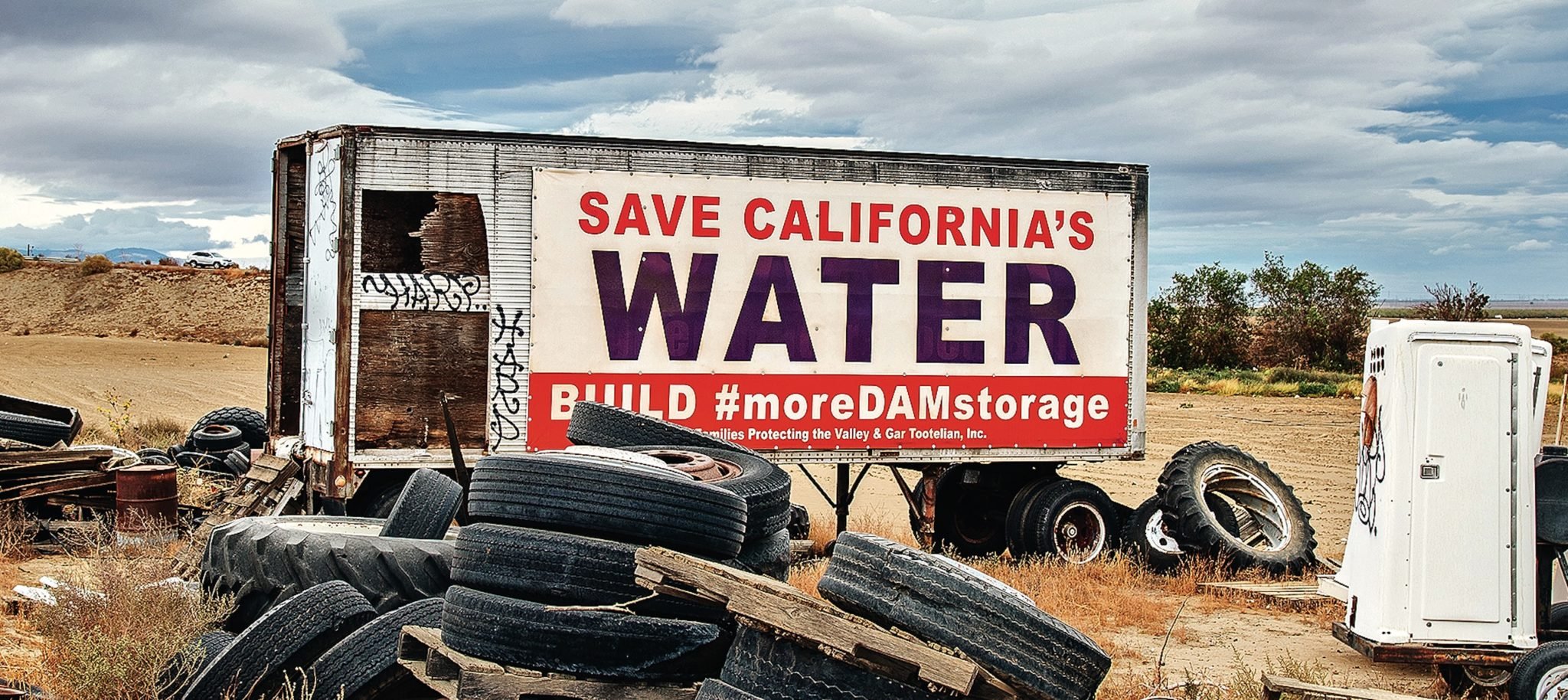 A sign saying "Save California's Water"