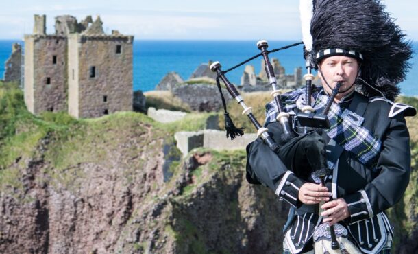 bagpiper in traditional dress