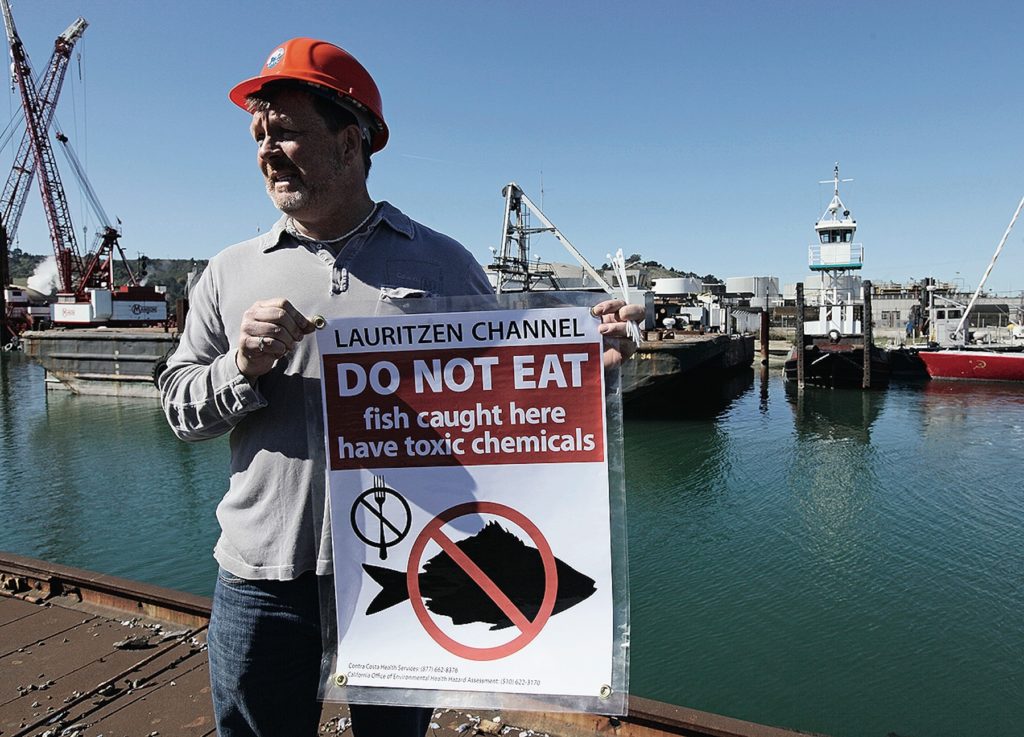 Man holds a sign that says Do Not Eat