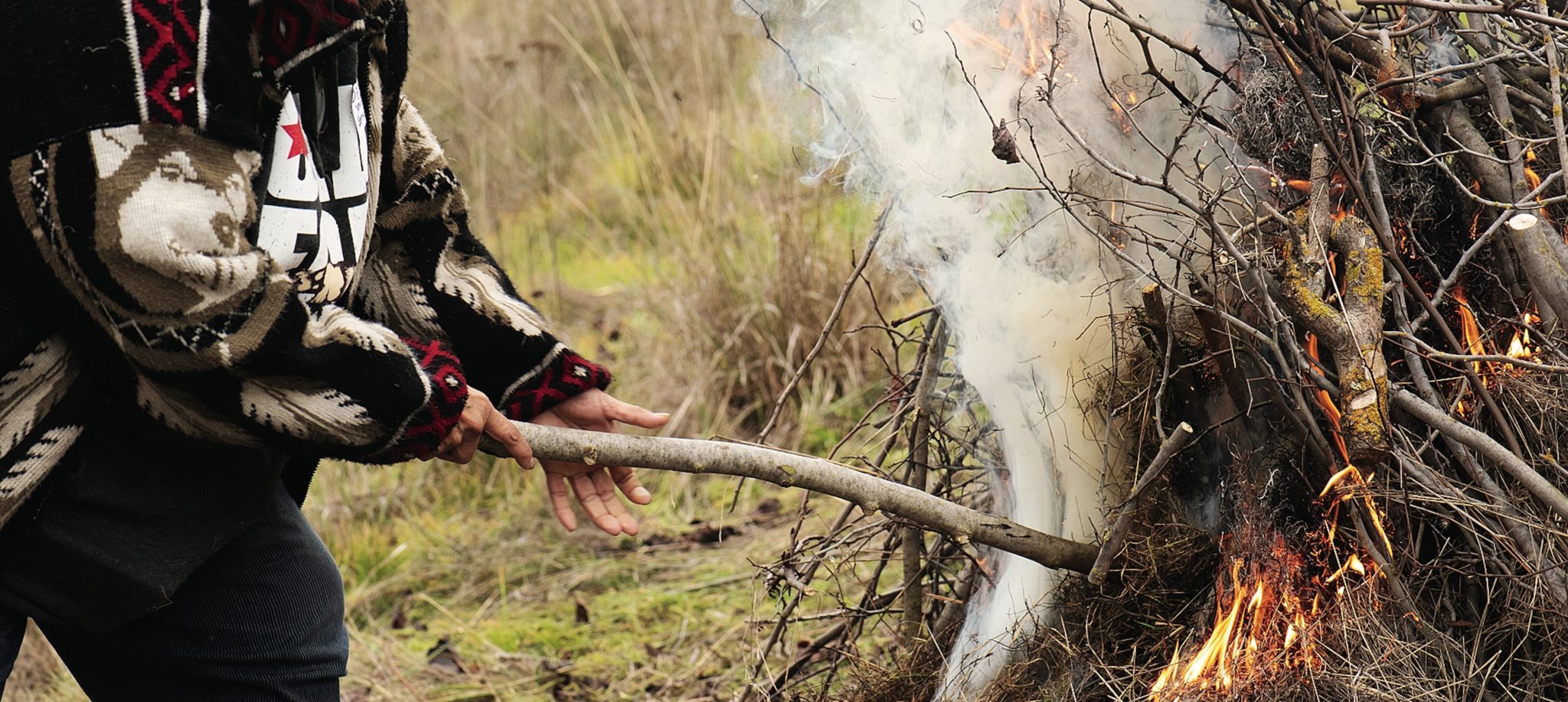 Woman burning wood