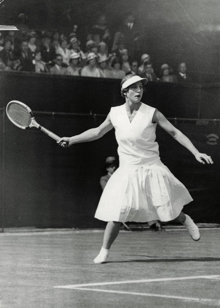 Helen Wills swings her racket