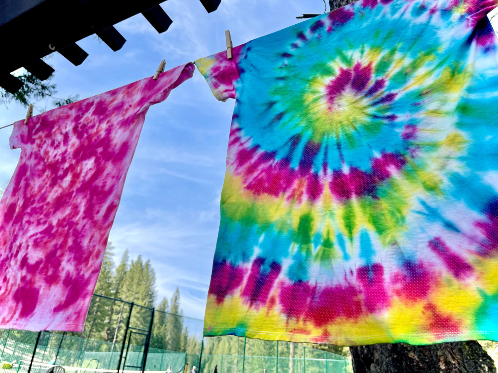 Two tie dye tee shirts out to dry