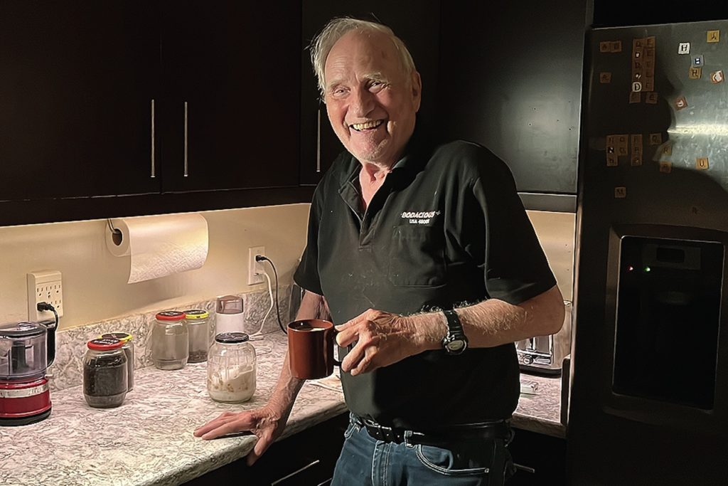 John F. Clauser stands in his kitchen at his home in Walnut Creek, Calif.,  on Tuesday, Oct. 4, 2022.