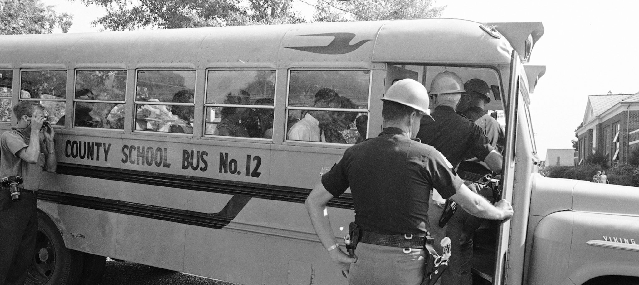 Police officers turning away a bus