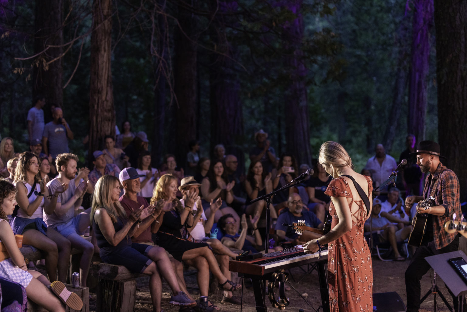 two musicians performing for audience outdoors at bear music fest