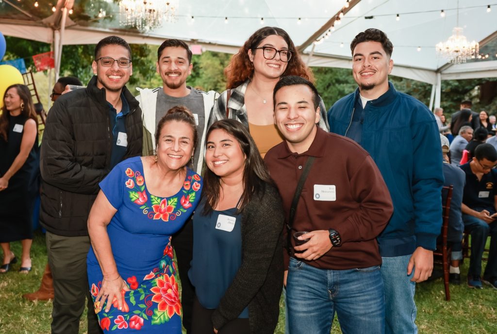 Lupe Gallegos-Diaz with UC Berkeley undergraduate students at a Chicanx Latinx Alumni Association reception.