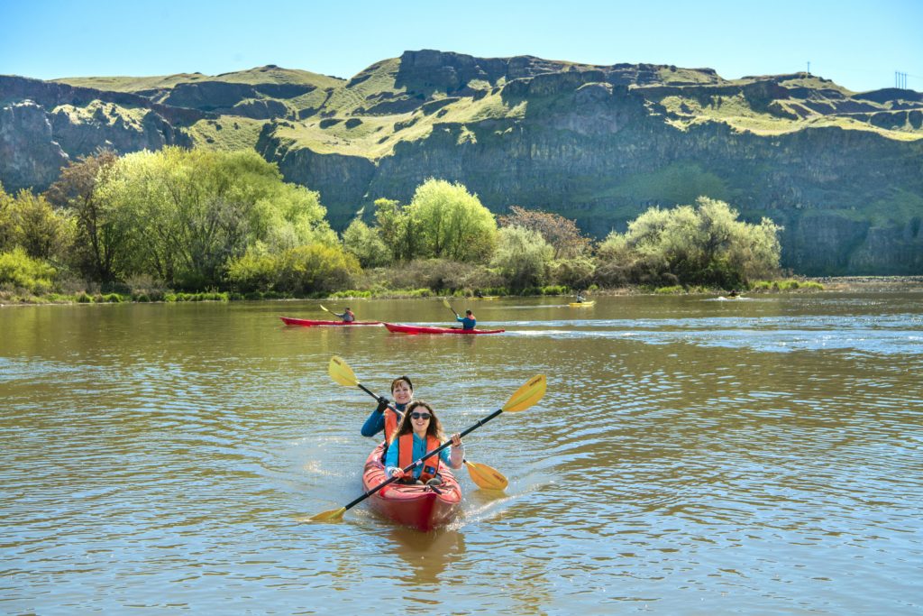 Two people kayaking on the river