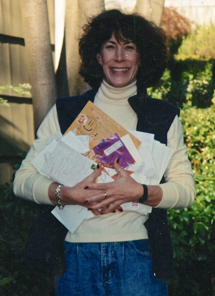 Portrait of young Nancy Rubin holding letters