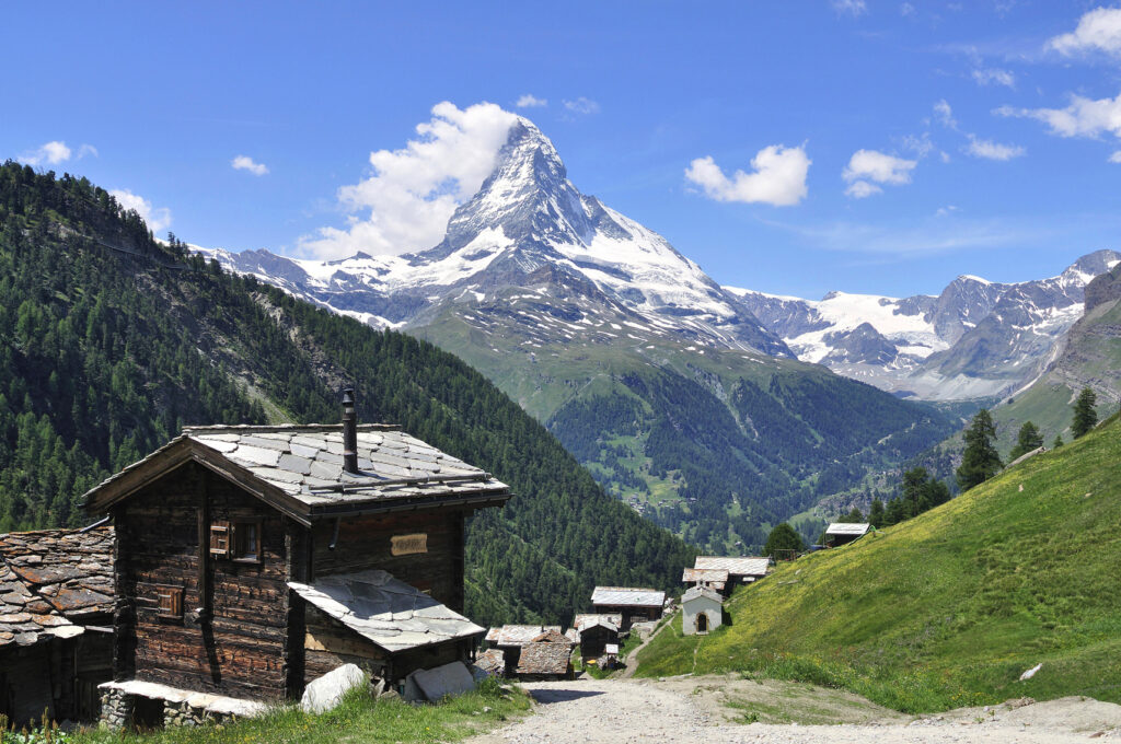 Mountain village in front of snowy Matterhorn,