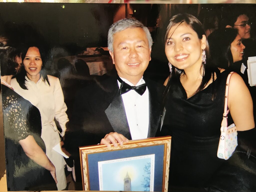 Jesse Ante and Rona Osmani posing at a CAA gala with Ante's Mentor of the Year award. 