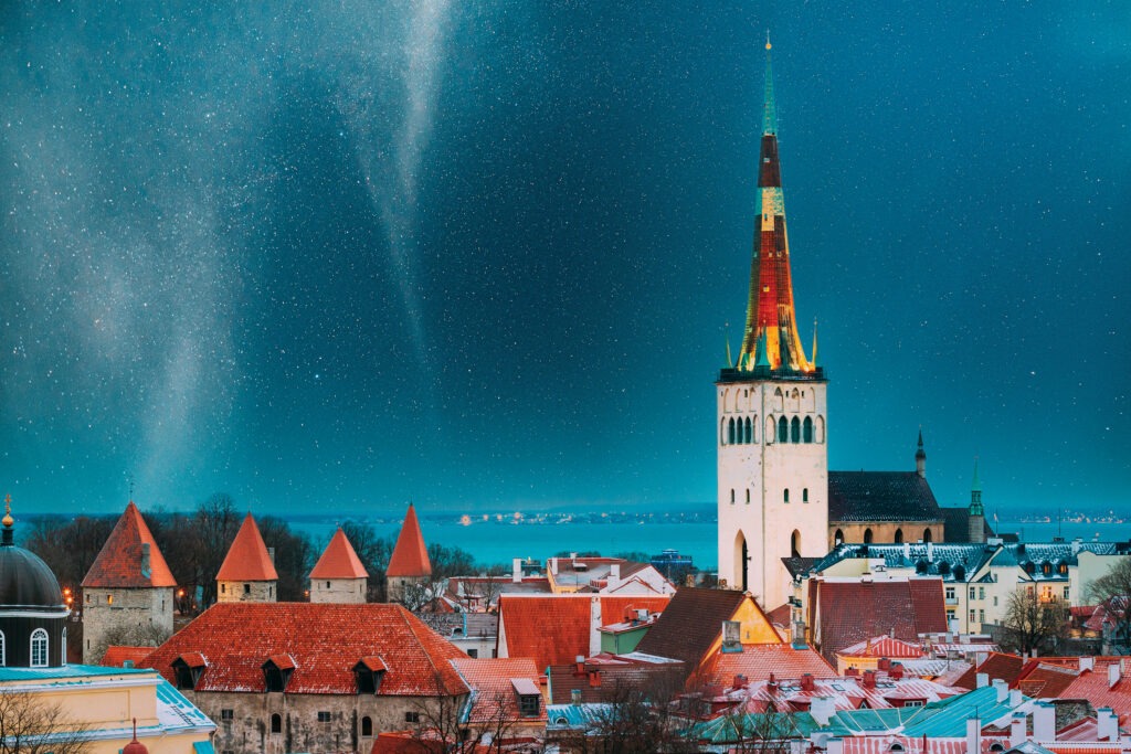 Buildings of Tallinn, Estonia under a starry night sky