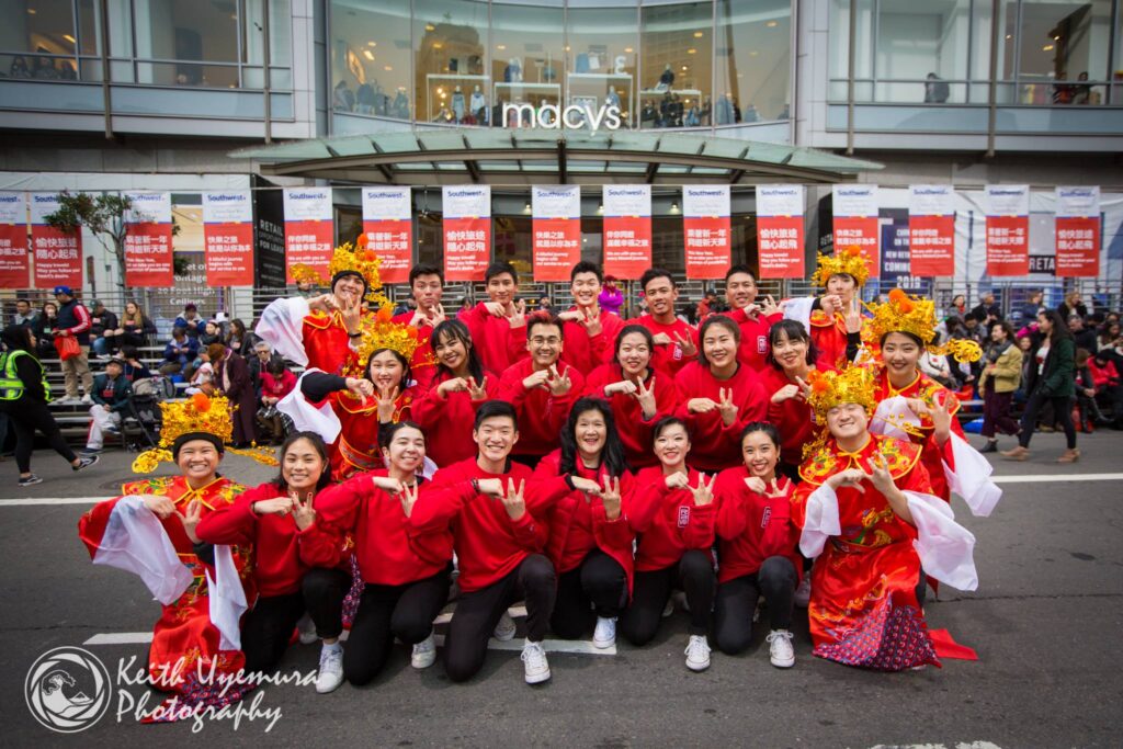 Robert Yu poses with his performance dance team at the 2021 San Francisco Chinese New Year parade. 