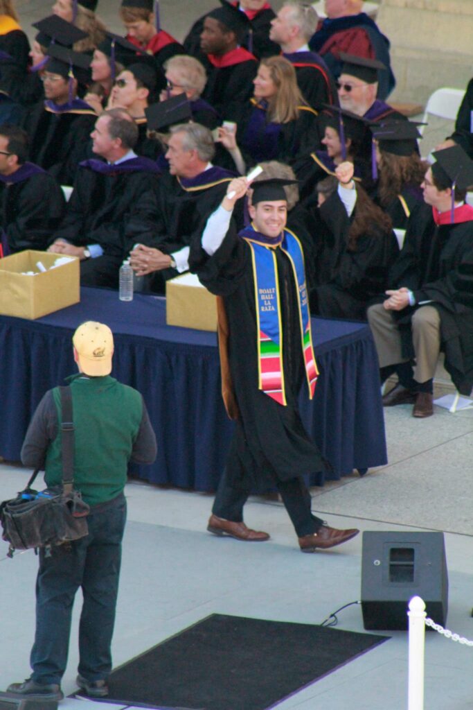 Anderson Franco walks across the stage at his Berkeley Law graduation. 
