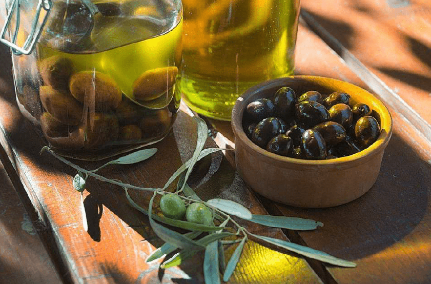 Fresh olives and olive oil
