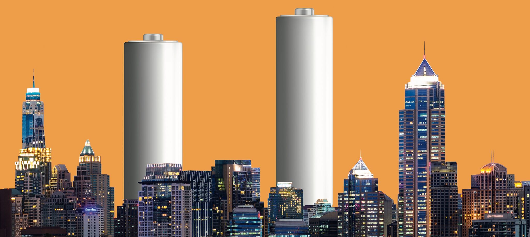 batteries behind a city skyline