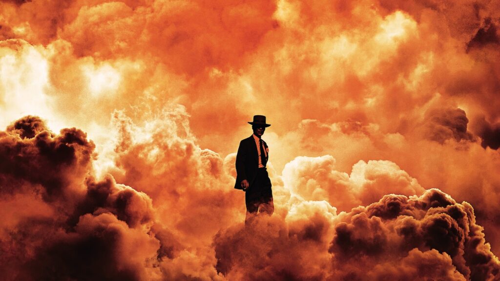 Oppenheimer stands in fiery clouds