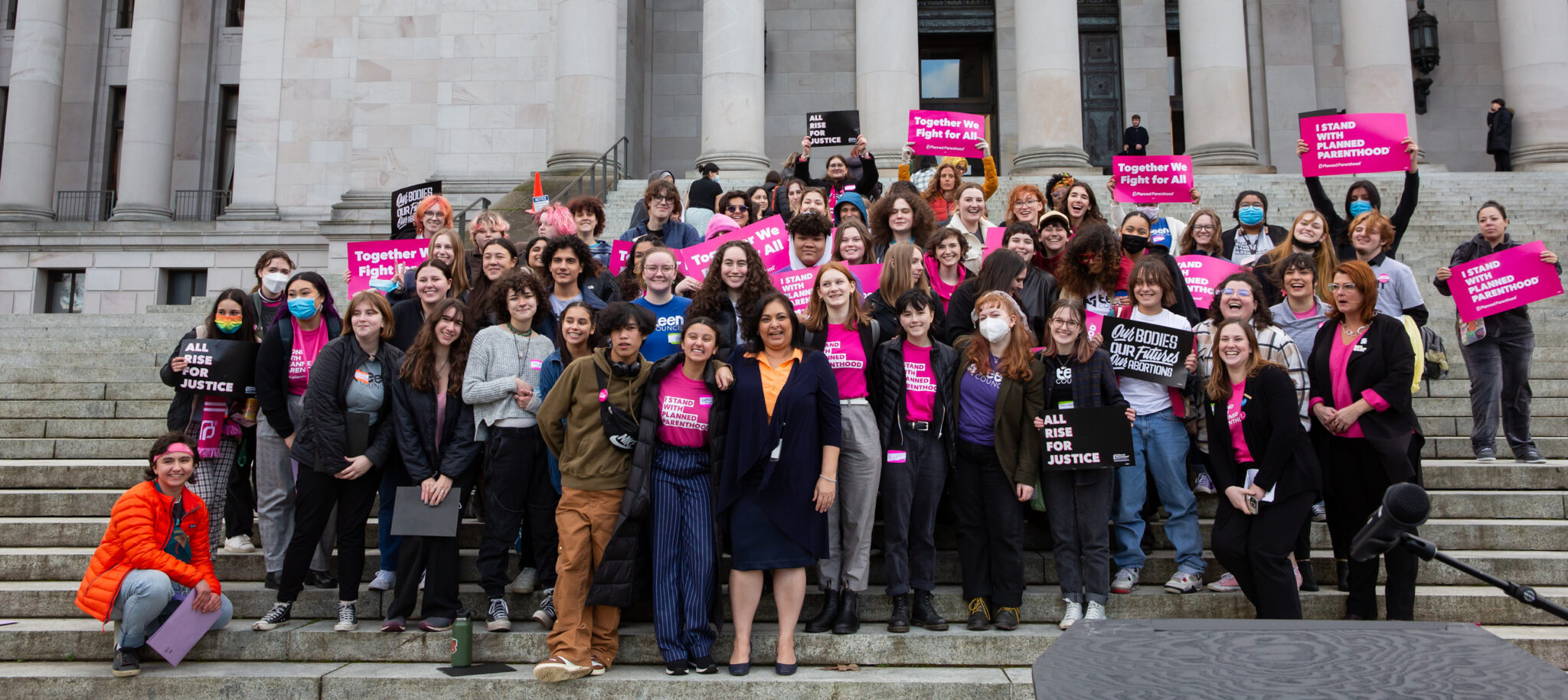 Dhingra with Planned Parenthood advocates on the north steps of the state capitol building