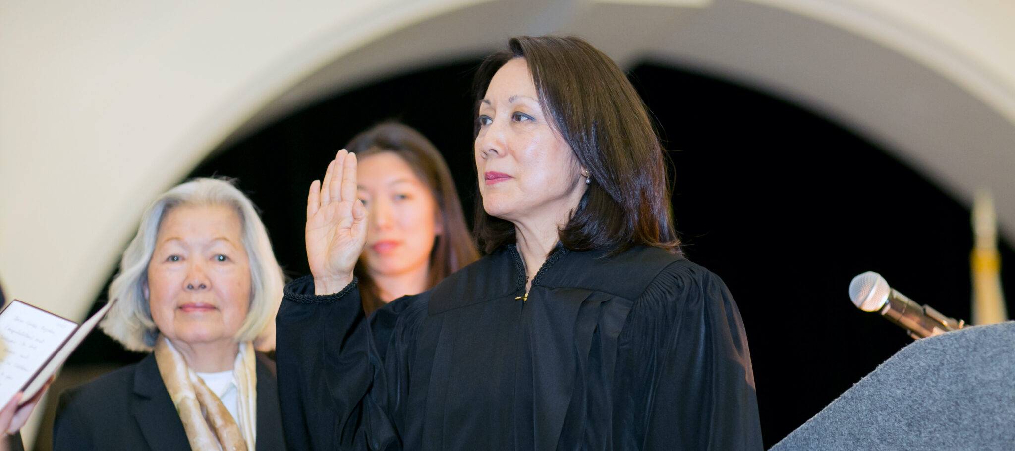 Margaret being sworn in as a judge as her mother and daughter look on