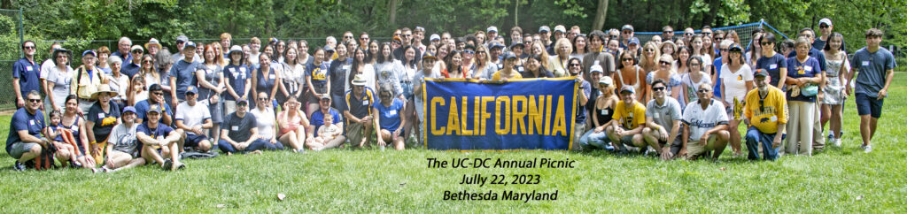 Attendees at the Cal Alumni Club of Washington D.C. Annual Picnic pose with a banner that says "California." 
