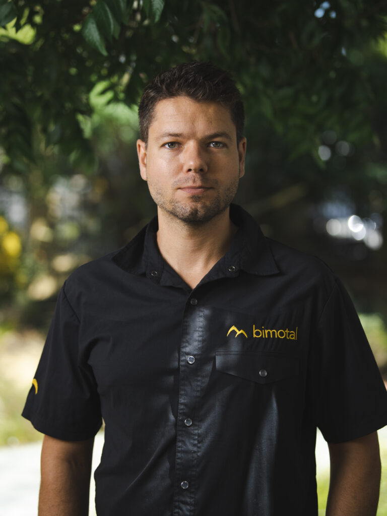 A headshot of Toby Ricco wearing a Bimotal shirt. 