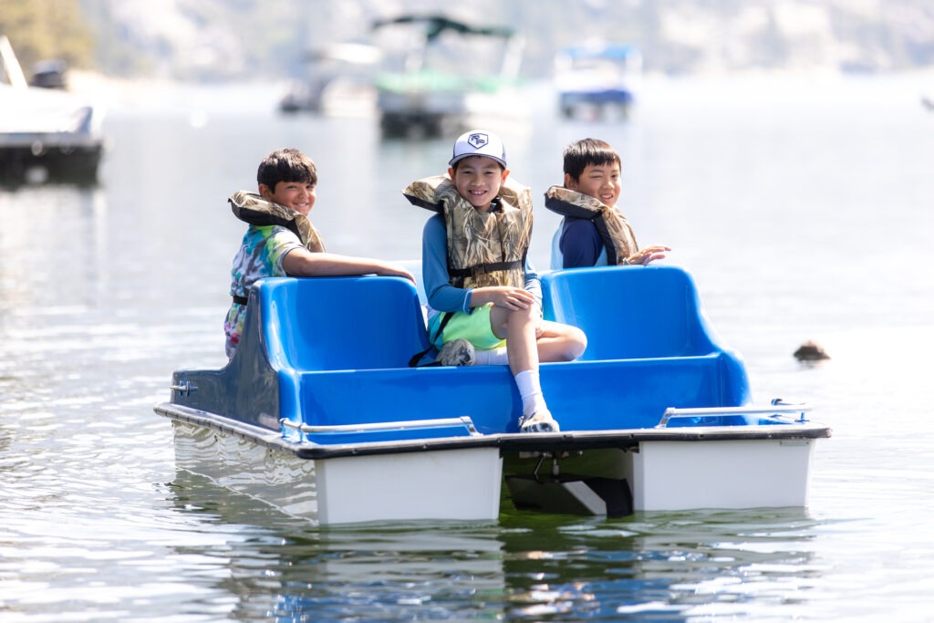 3 boys on a paddleboat