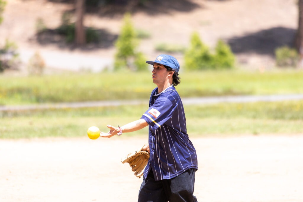 a person pitching a softball
