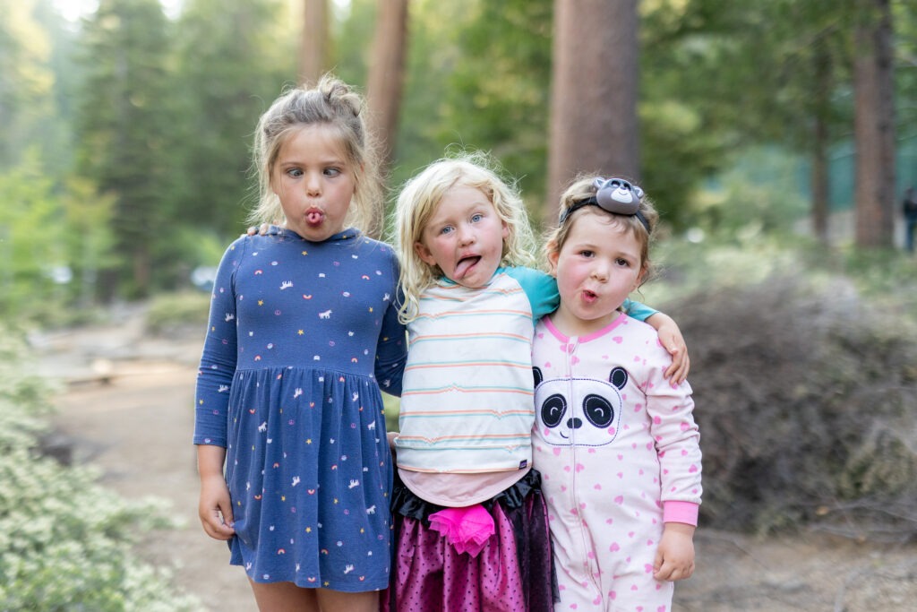 3 young girls making silly faces