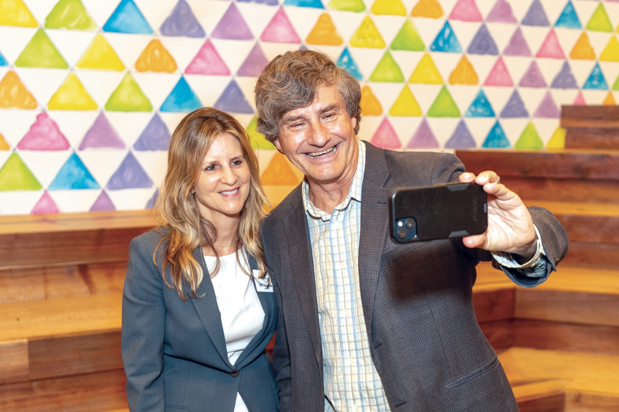 Astrophysicist and Cal professor Alex Filippenko snaps a photo with Executive Director Susie Cohen Crumpler at a recent California Live! event.