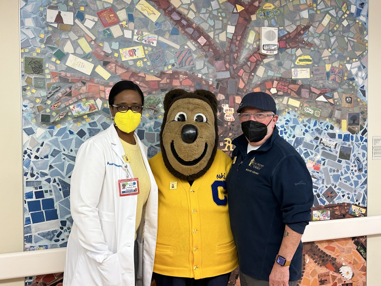 Roberts poses with Oski at Kaiser Permanente's pediatric ward.