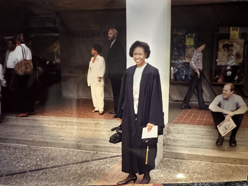 Marsha Roberts wearing her graduation gown at her graduation ceremony. 