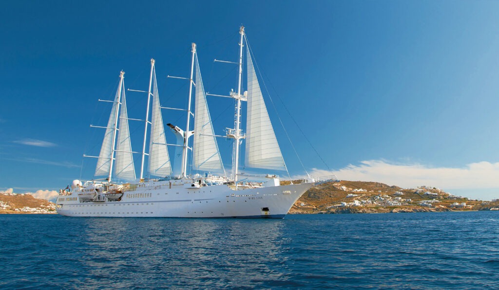 Exterior of Wind Star ship sailing on calm waters under blue skies